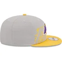snapback-9fifty-draft-edition-2023-los-angeles-lakers-nba-od-new-era-szara-i-zolta-czapka-z-plaskim-daszkiem