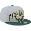 szara-i-zielona-czapka-z-daszkiem-snapback-9fifty-tip-off-2023-milwaukee-bucks-nba-od-new-era
